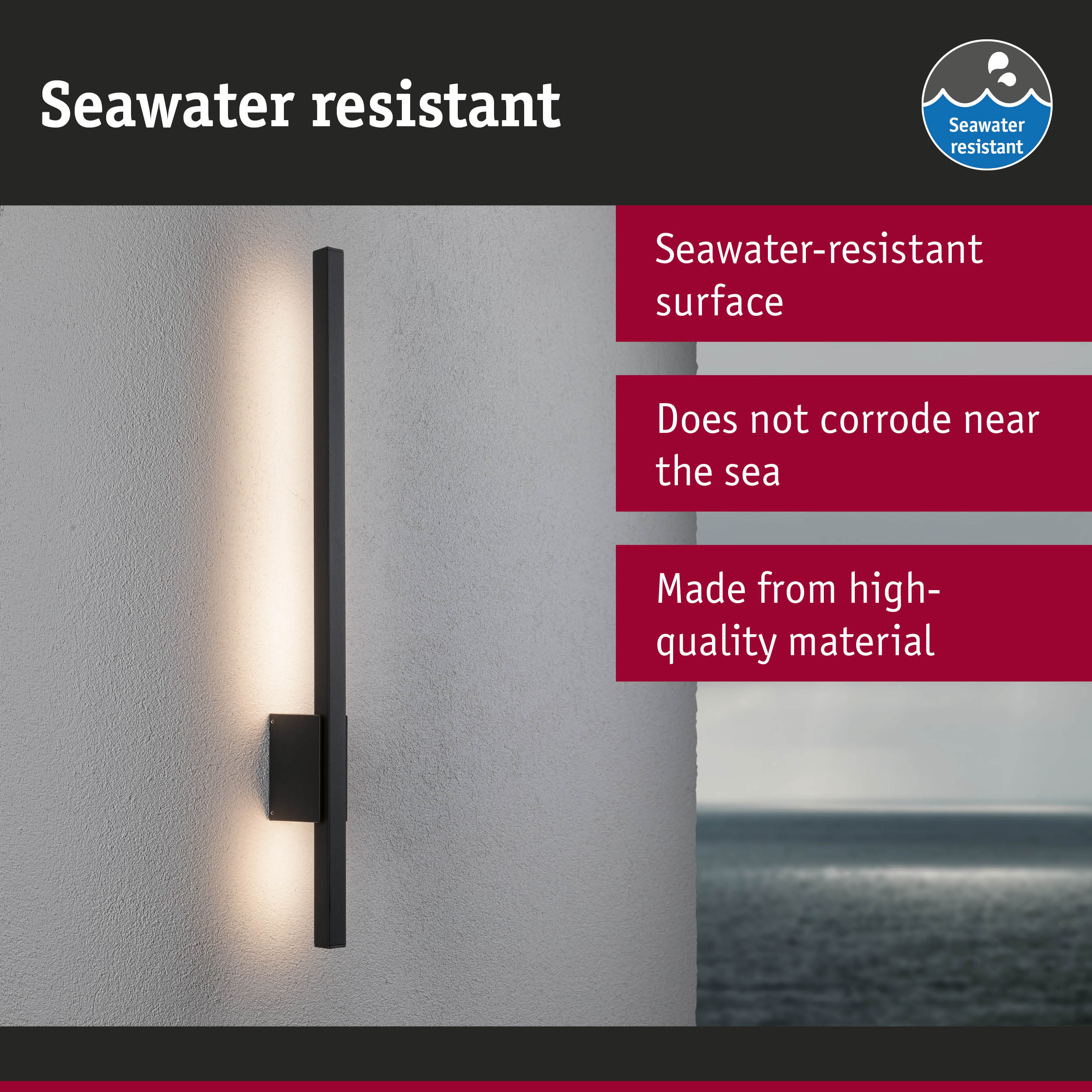 Black LED wall light with seawater-resistant surface mounted on grey wall overlooking the sea