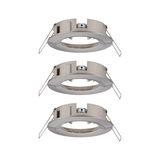Three round brushed stainless steel recessed frames in silver for LED spotlights.