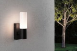 Modern black metal outdoor wall light with white glass, perfect for garden lighting solutions.