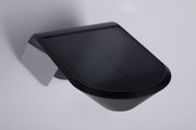 Black plastic solar light with solar panel for energy-efficient outdoor lighting solutions