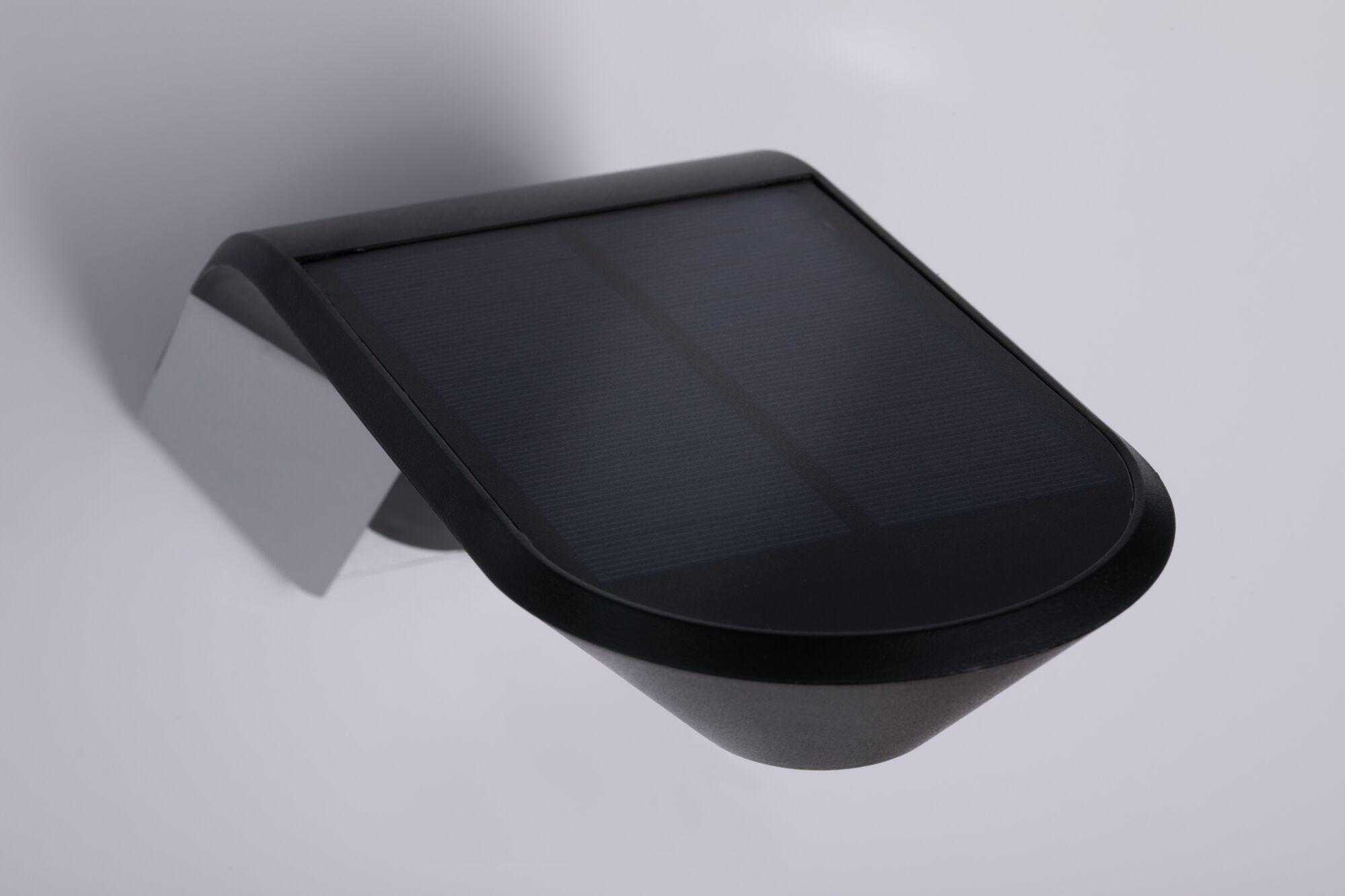 Black plastic solar light with solar panel for energy-efficient outdoor lighting solutions