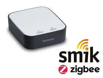 Compact smik Zigbee gateway in black and white for smart home control with Paulmann branding.