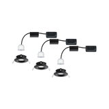 Three black recessed frames with white LED modules and cables for modern LED downlights.