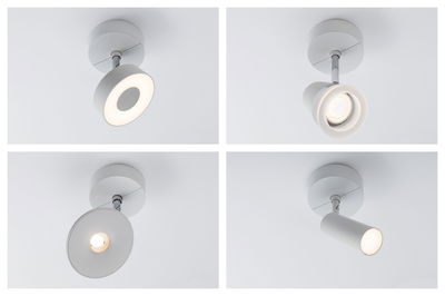 Four white metal ceiling spotlights with different LED light types for modern room lighting.