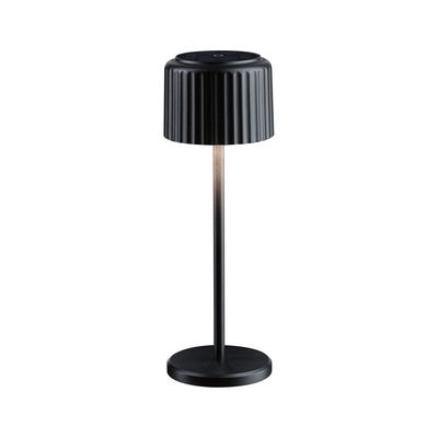 Black metal LED table lamp with ribbed shade and dimmable light for modern interior lighting
