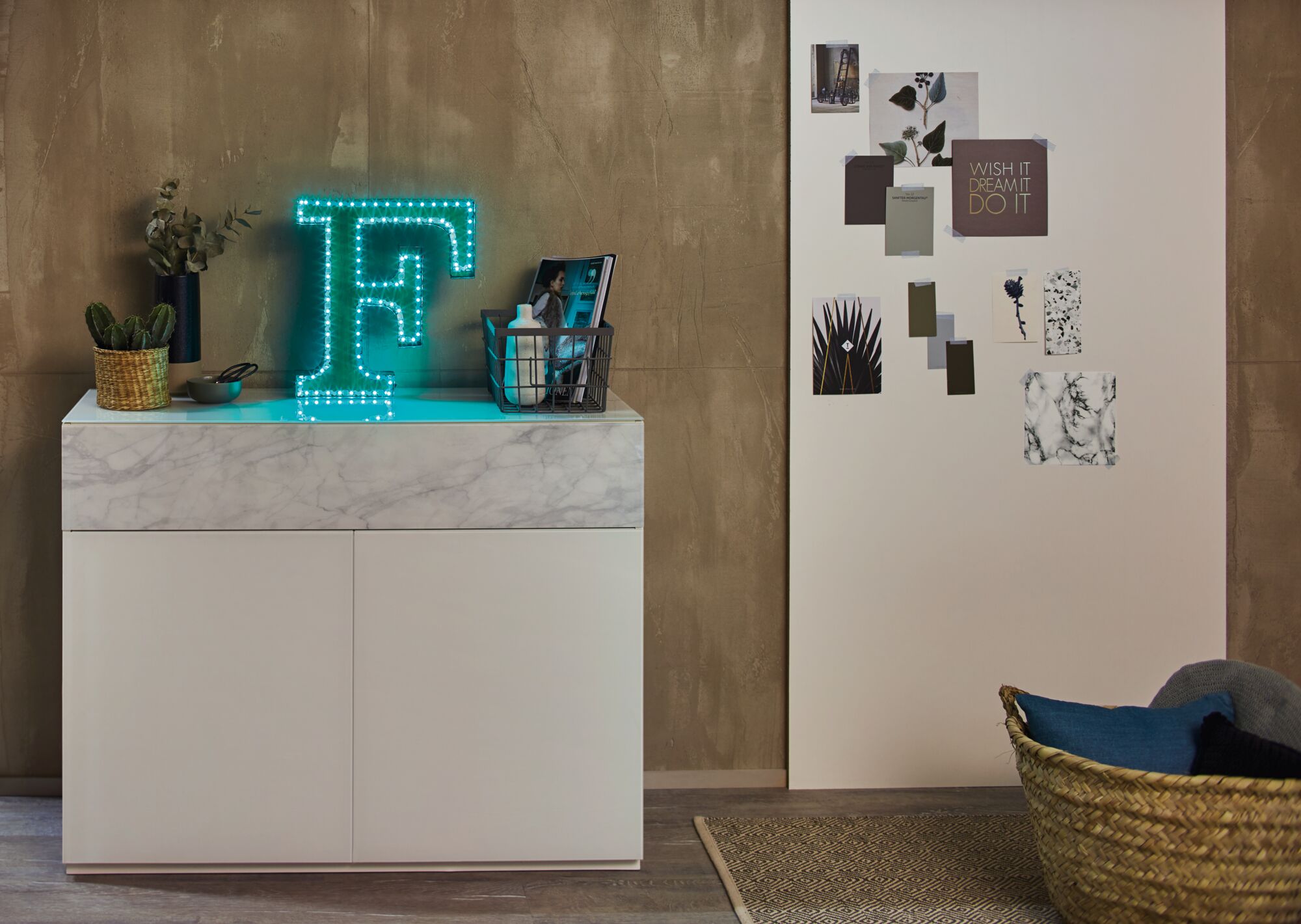 Blue LED letter F light on white marble-effect sideboard in modern living room decor