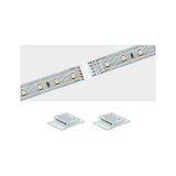 LED strip with transparent connector for flexible white light lighting solutions.