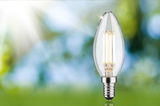 Clear LED candle bulb with E14 base, energy-efficient lighting for home use.