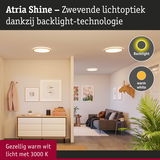 Atria Shine LED-plafondlampen met warm wit licht en backlight-technologie in een moderne woonkamer.