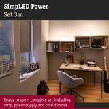 Modern workspace with wooden desk and metal frame illuminated by LED strip light with dimmer