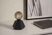 Modern black table lamp with geometric base and gold dot pattern, decorative LED lighting for home