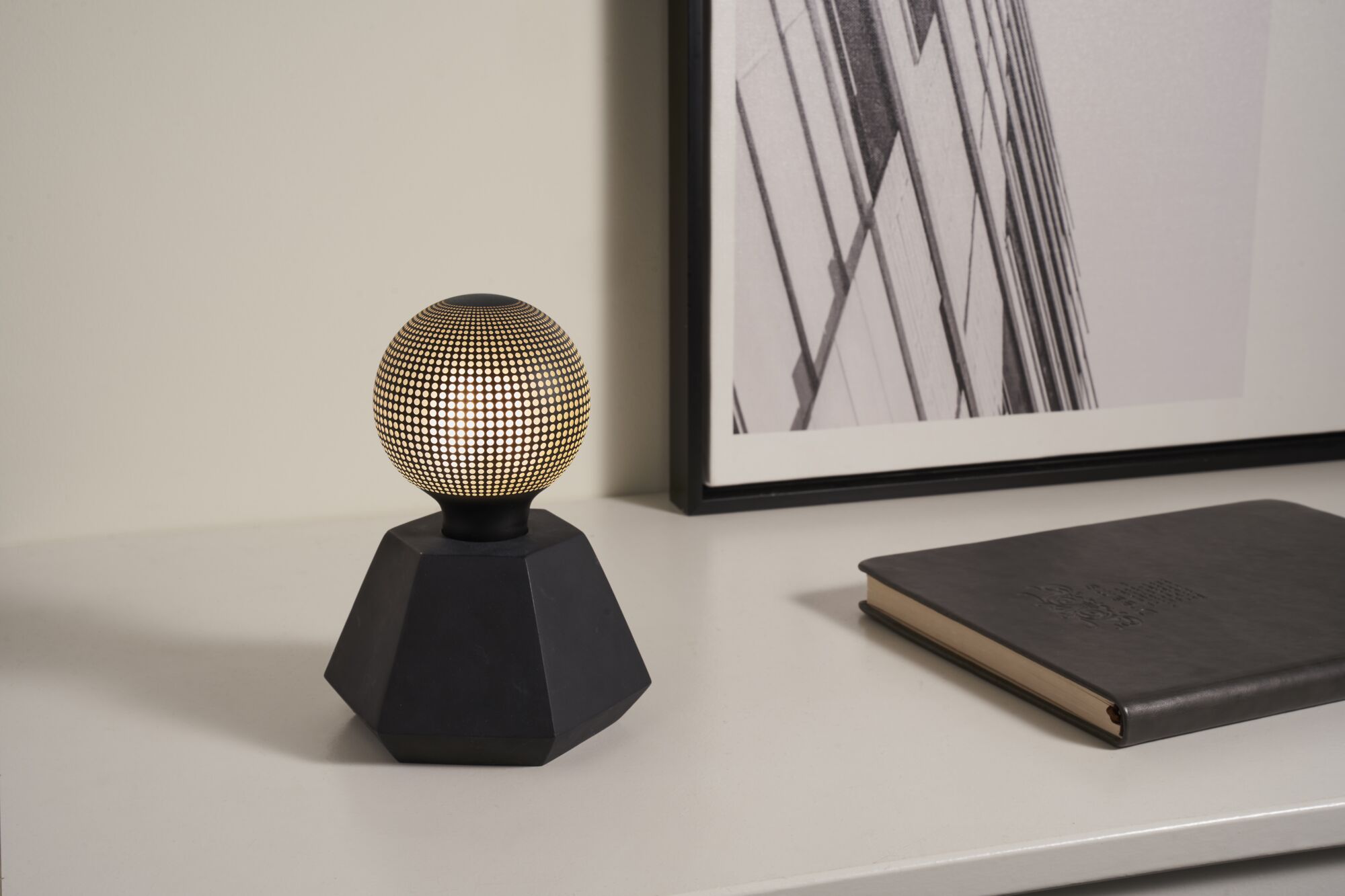 Modern black table lamp with geometric base and gold dot pattern, decorative LED lighting for home