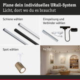 Modulares URail-Schienensystem mit weißen und schwarzen Schienen, Steckern und goldfarbenem Spot für flexible Beleuchtung