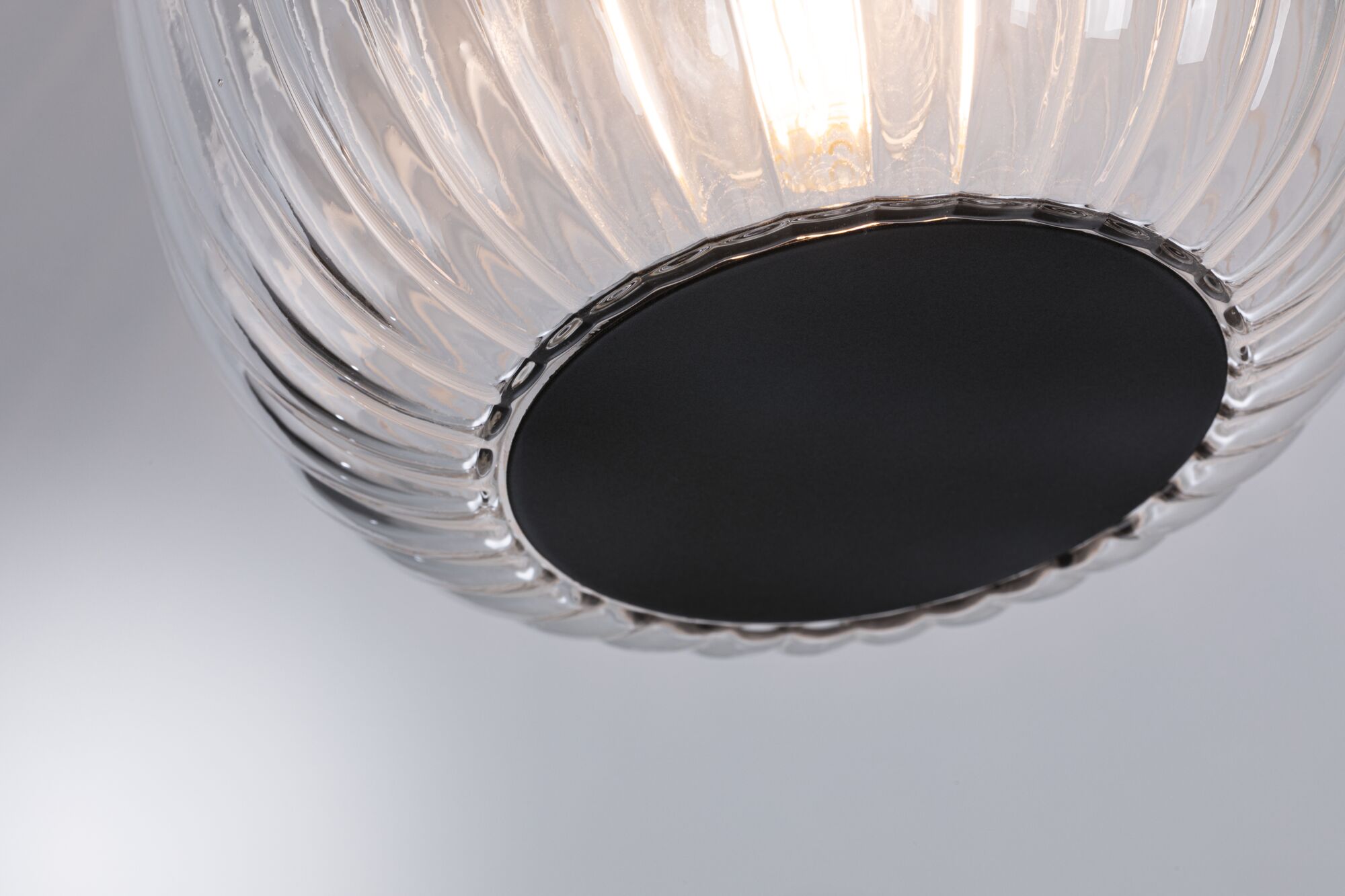 Modern ceiling light with clear glass and black base, stylish LED lighting fixture