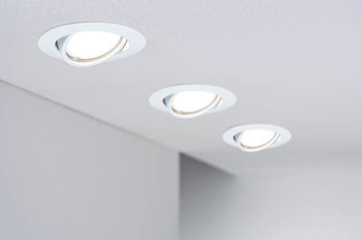 Three white LED recessed spotlights in ceiling with adjustable design for flexible room lighting