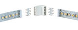 White plastic corner connector for 24V LED strips with metal pins for easy connection