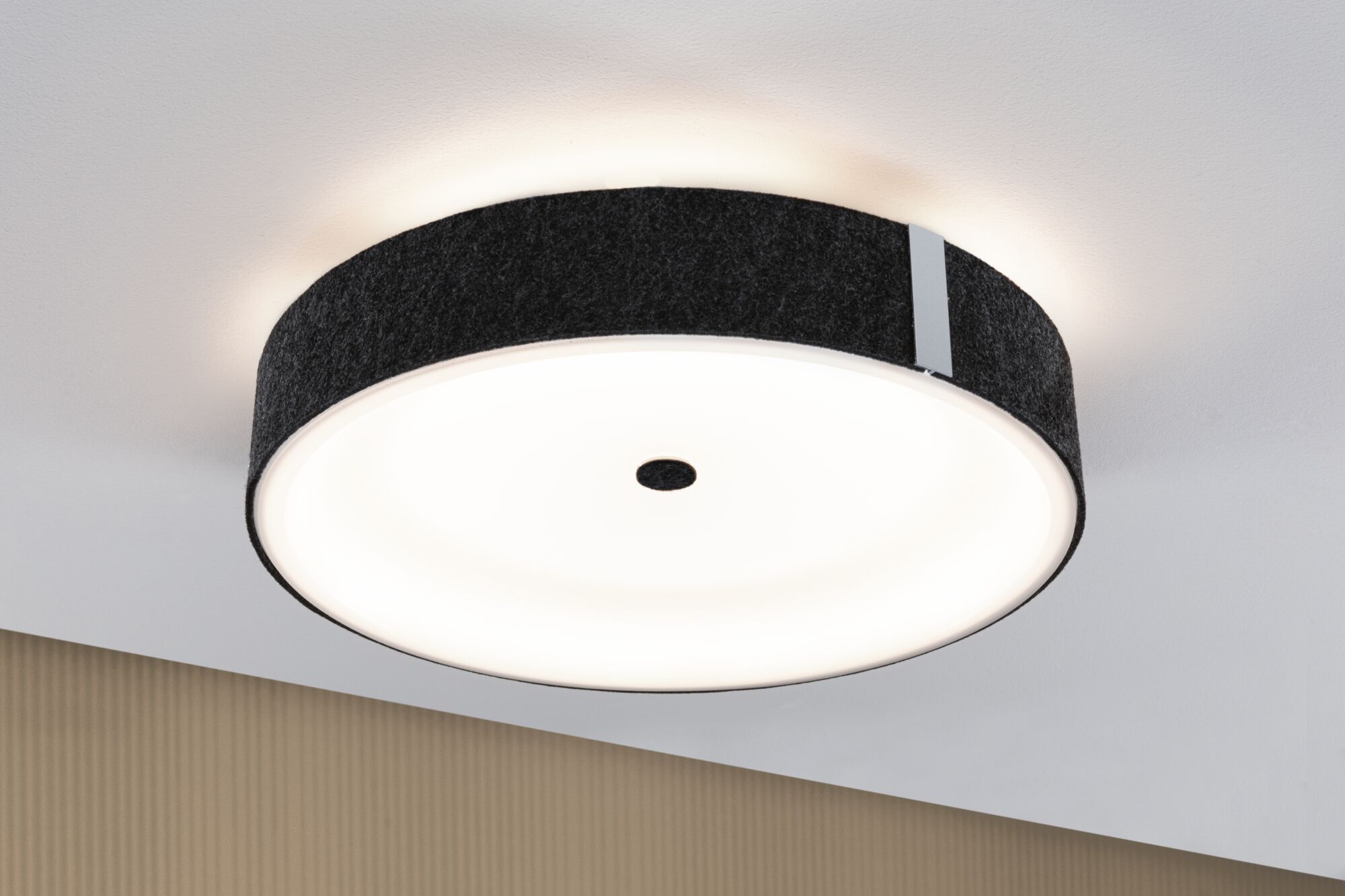 Round ceiling light with black felt edge and diffused white cover for modern room lighting