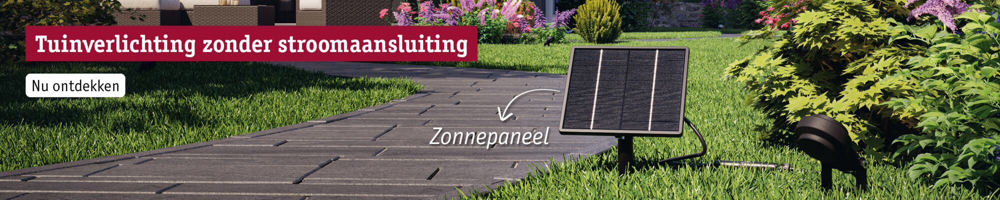 Zwart omlijst zonnepaneel op gras naast tuinpad voor stroomloze tuinverlichting