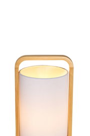 Modern floor lamp with light fabric shade and natural wood frame for cozy living spaces