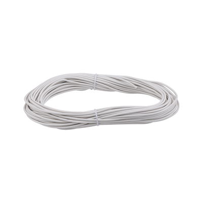 White flexible electrical cable coiled and secured with ties for wiring and electrical installations