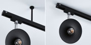 Black ceiling light with round reflector and chrome rod, modern LED spotlight for indoor use.
