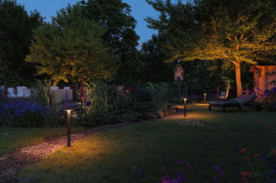 Modern garden path lighting with warm white LED and black metal post for outdoor ambiance.