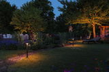 Modern garden path lighting with warm white LED and black metal post for outdoor ambiance.