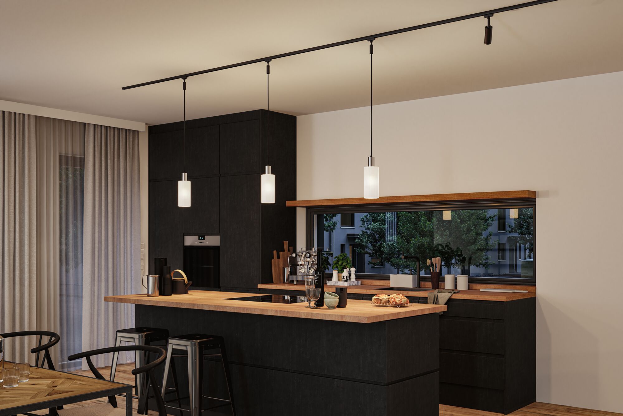 Modern kitchen with black wood cabinets and wooden countertop, three white pendant lights on black track lighting.