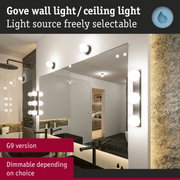 White G9 wall light with round glass globes in modern bathroom mirror lighting setup