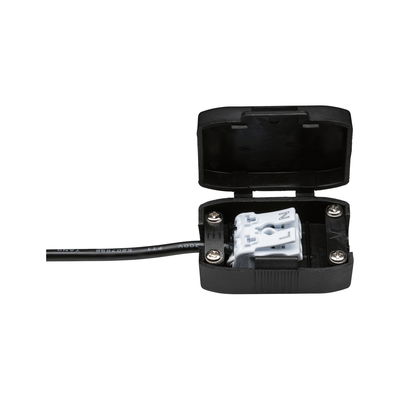 Black plastic housing with open lid and white cable connector for LED lighting installation