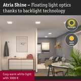 Modern living room with Atria Shine LED ceiling lights emitting warm white light and backlight technology