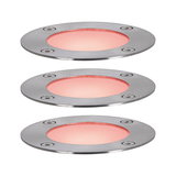 Three round LED recessed lights in brushed stainless steel with warm red light for outdoor use.