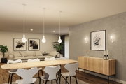 Salle à manger moderne avec table en bois clair, chaises blanches et suspensions minimalistes à lumière chaude