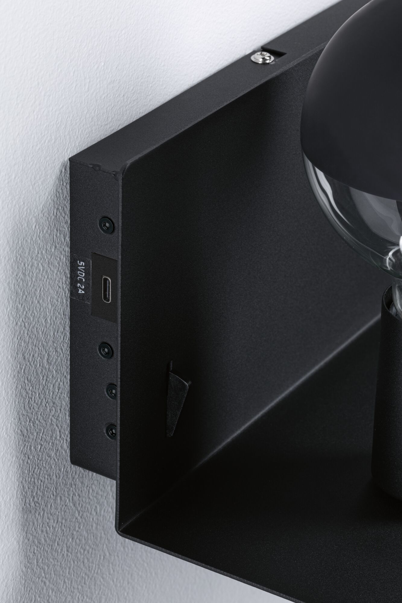 Black metal wall light with visible screws and USB-C port for modern indoor lighting solutions