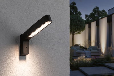 Black metal LED wall light with warm white illumination for modern outdoor and garden lighting solutions.