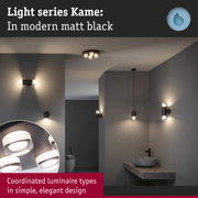 Matt black Kame light series with coordinated wall and ceiling lamps in modern bathroom setting
