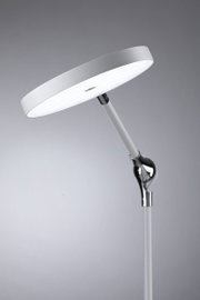 Modern white LED floor lamp with round light head and adjustable metal and plastic arm for living spaces.
