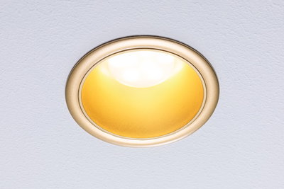 Round recessed LED light with gold frame and warm white light for home lighting solutions