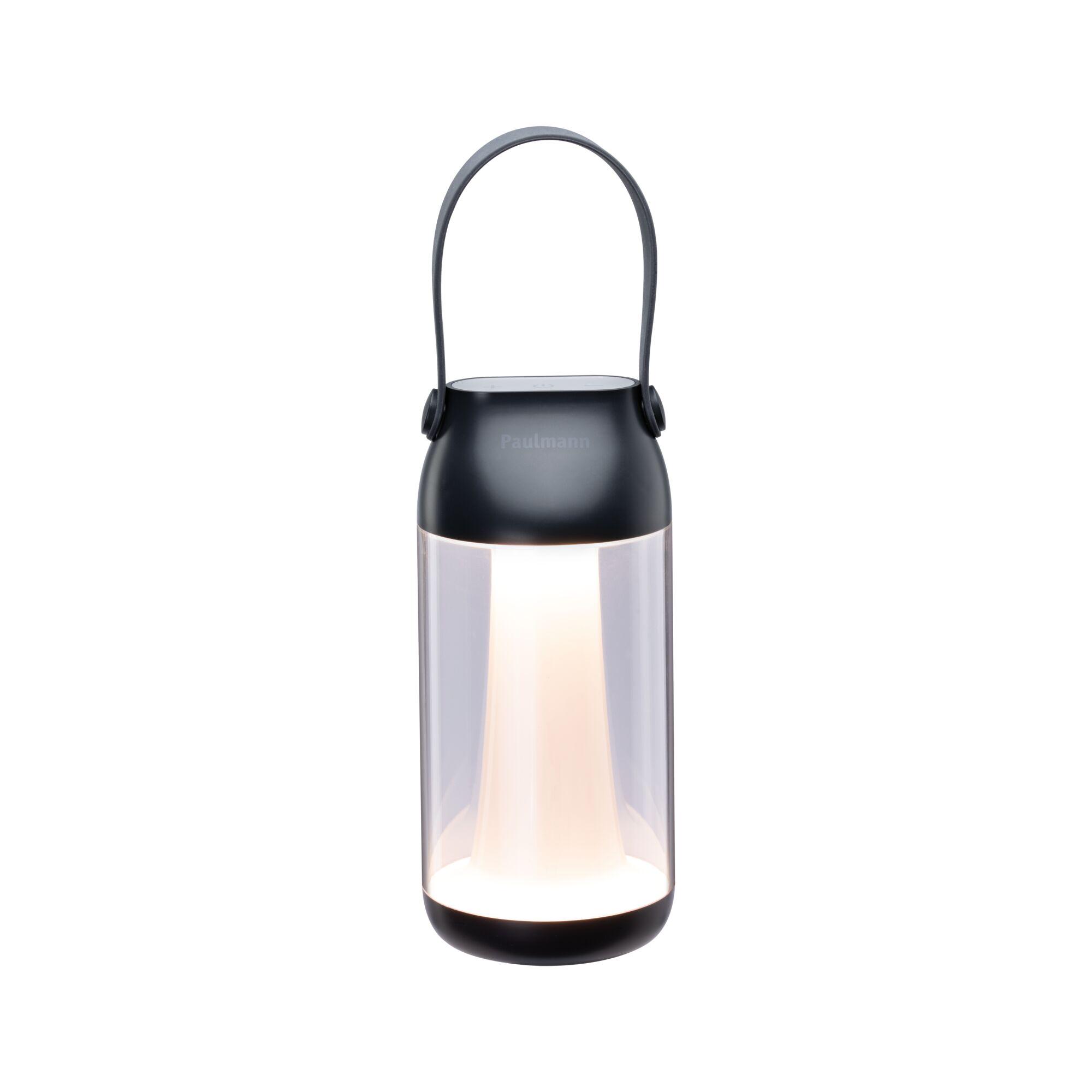 Black portable LED lantern with clear plastic body and handle for outdoor lighting use