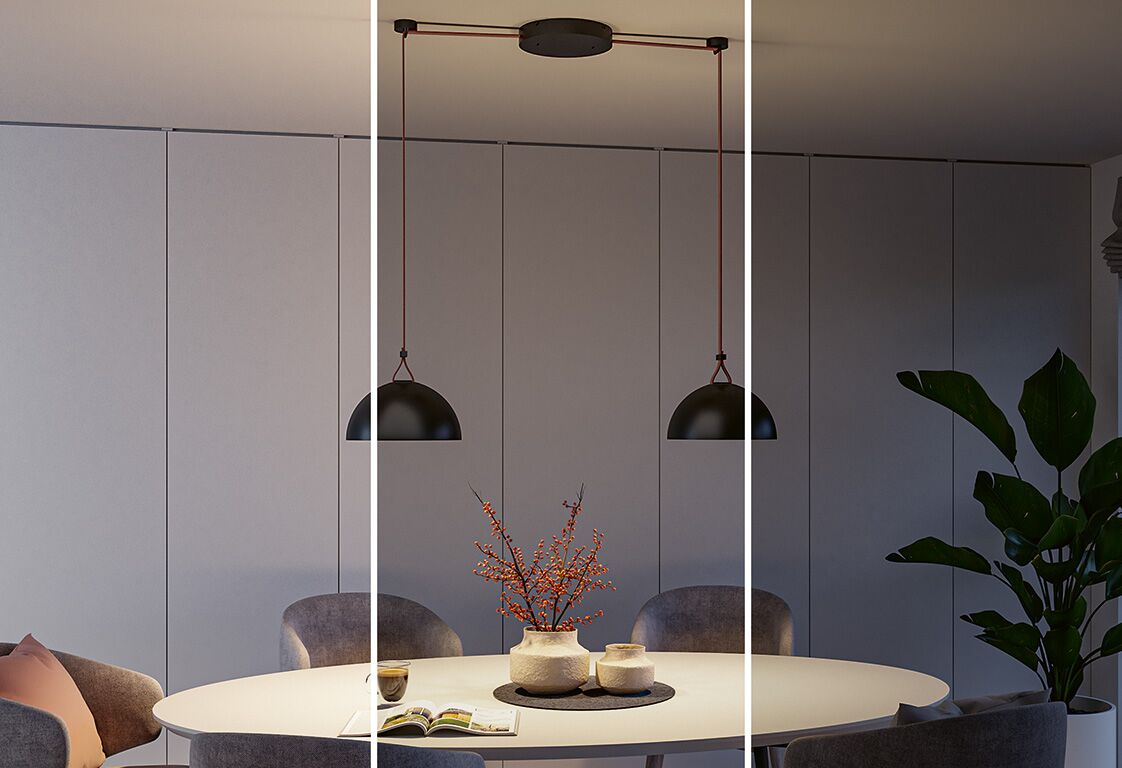 Moderne zwarte metalen hanglamp met twee koepelvormige kappen boven ronde eettafel met decoratie en stoelen