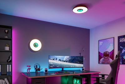 Round ceiling and wall light with white glass and green LED accent in modern gaming room setup.