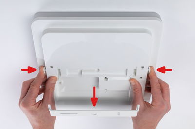 White square plastic ceiling light with mounting guide and hand grips for easy installation