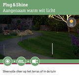 Tuinpad met warm wit licht van slanke buitenlampen voor sfeervolle terras- en tuinverlichting