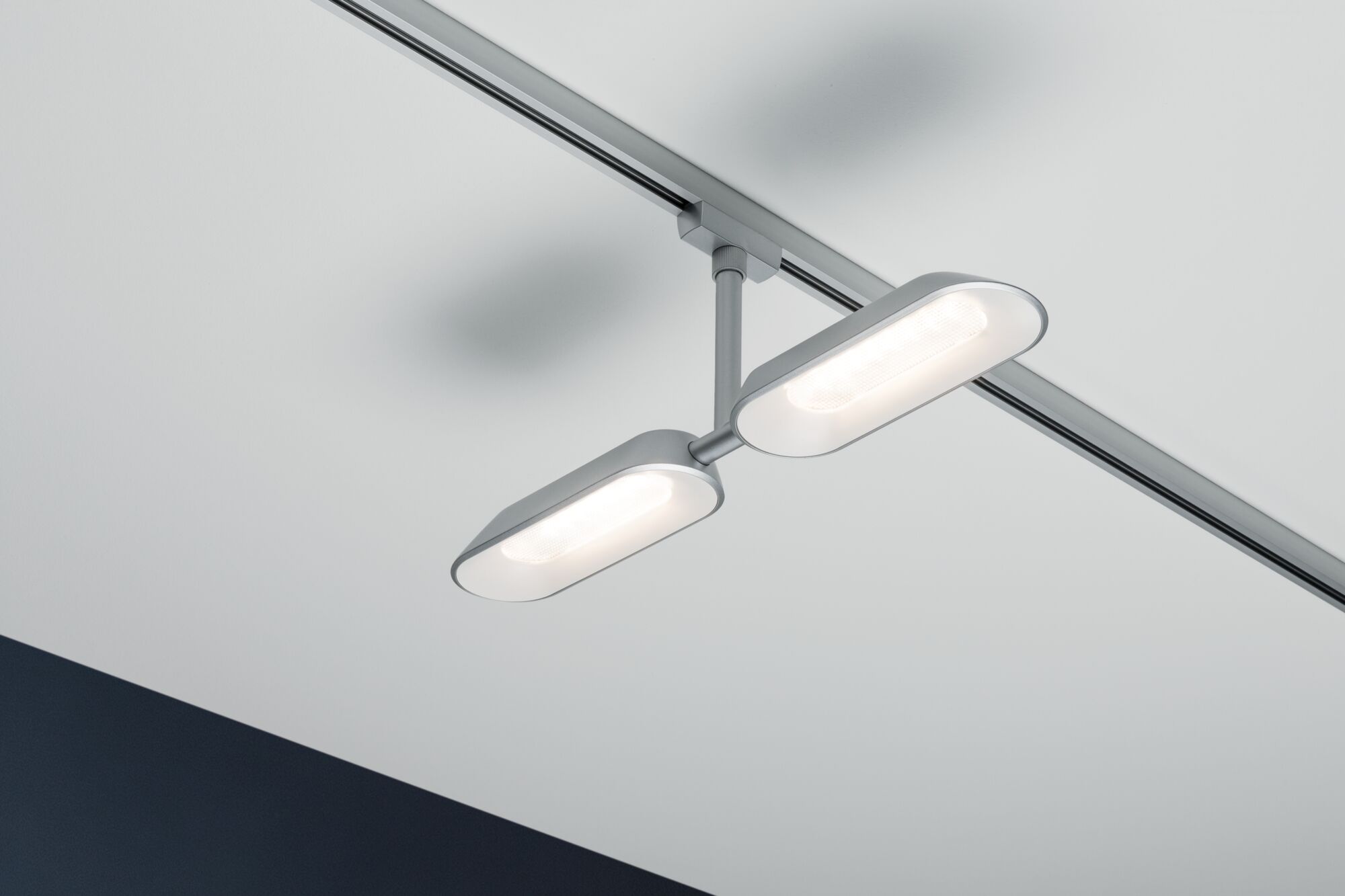 Modern silver LED ceiling light with two oval panels for efficient room illumination and energy saving