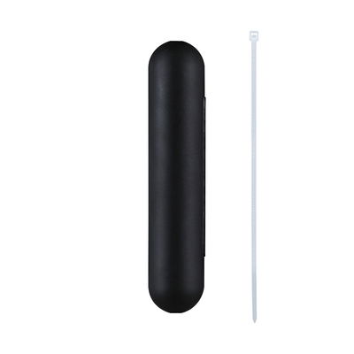 Black plastic casing with rounded ends and white cable tie for cable management.