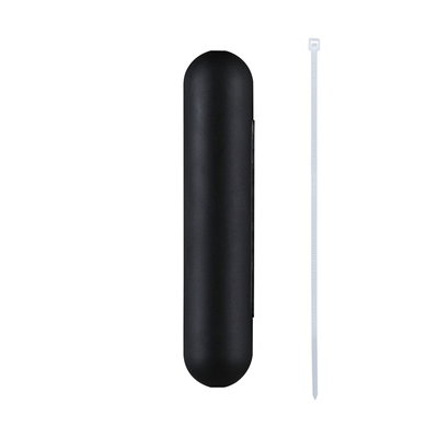 Black plastic casing with rounded ends and white cable tie for cable management.
