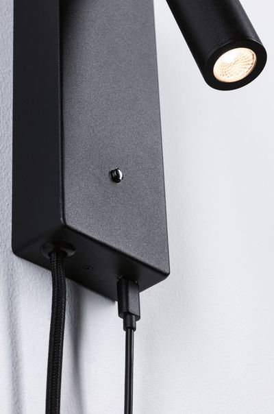 Black metal LED wall light with flexible head and fabric cable for modern interior lighting