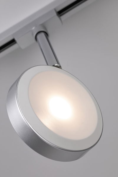 Modern round silver LED spotlight with white diffuser for track lighting systems