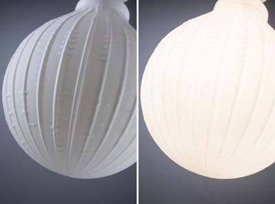 White glass pendant lamp with ribbed texture, modern design for ambient home lighting.