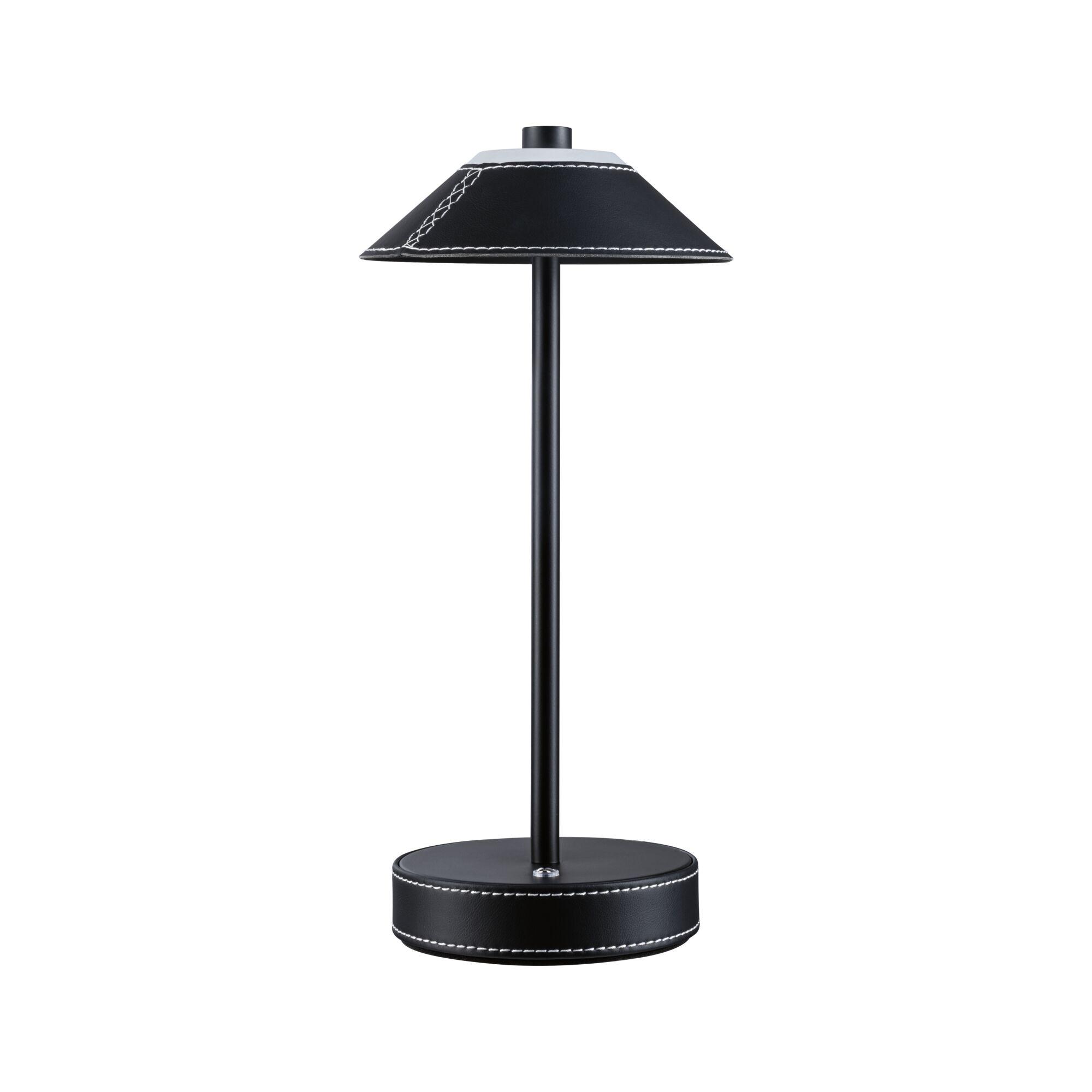 Black table lamp with leather cover and white stitching, modern LED desk lighting design